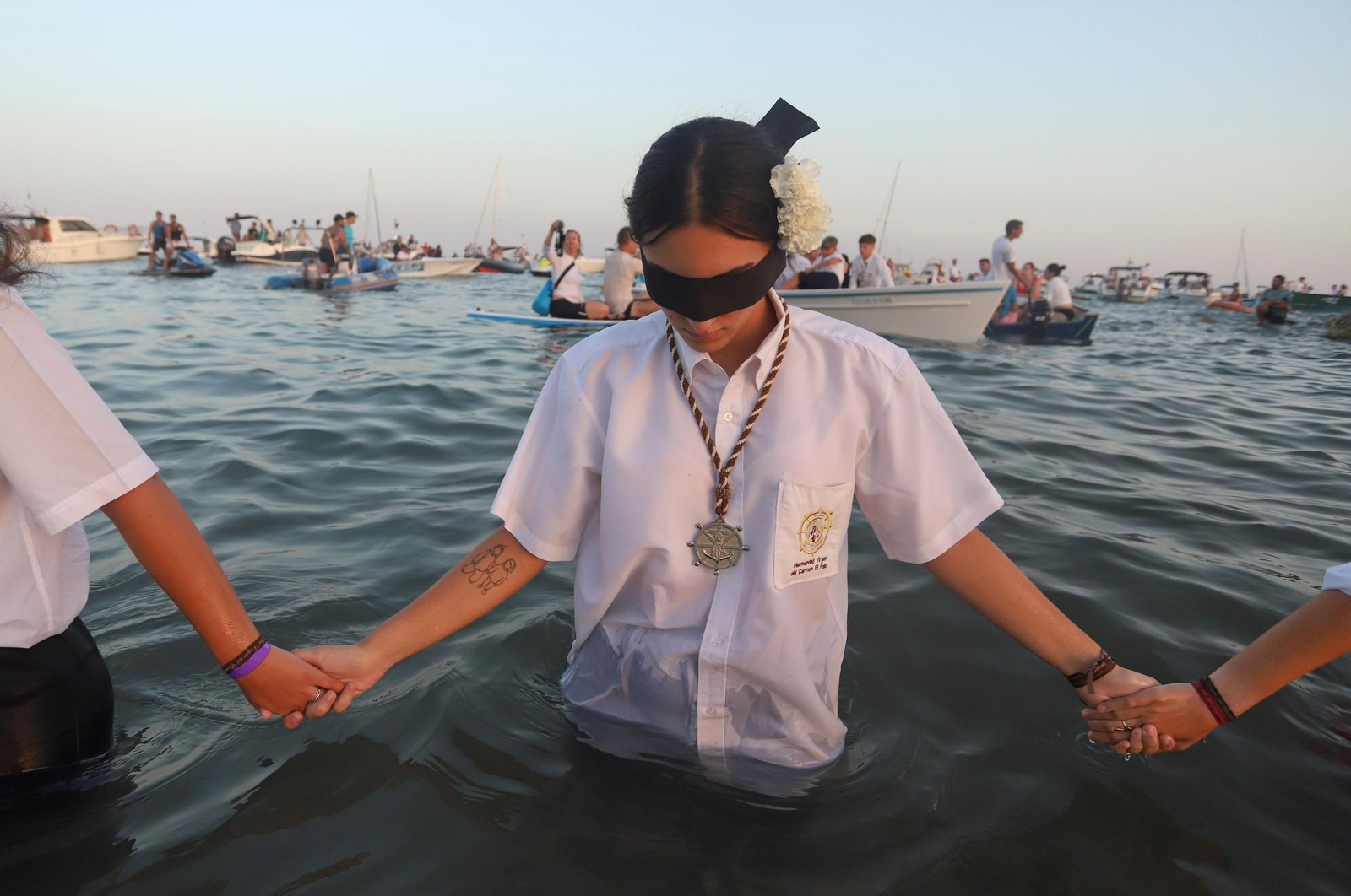 La procesión de la Virgen del Carmen en la playa del Palo, en Málaga, en fotos