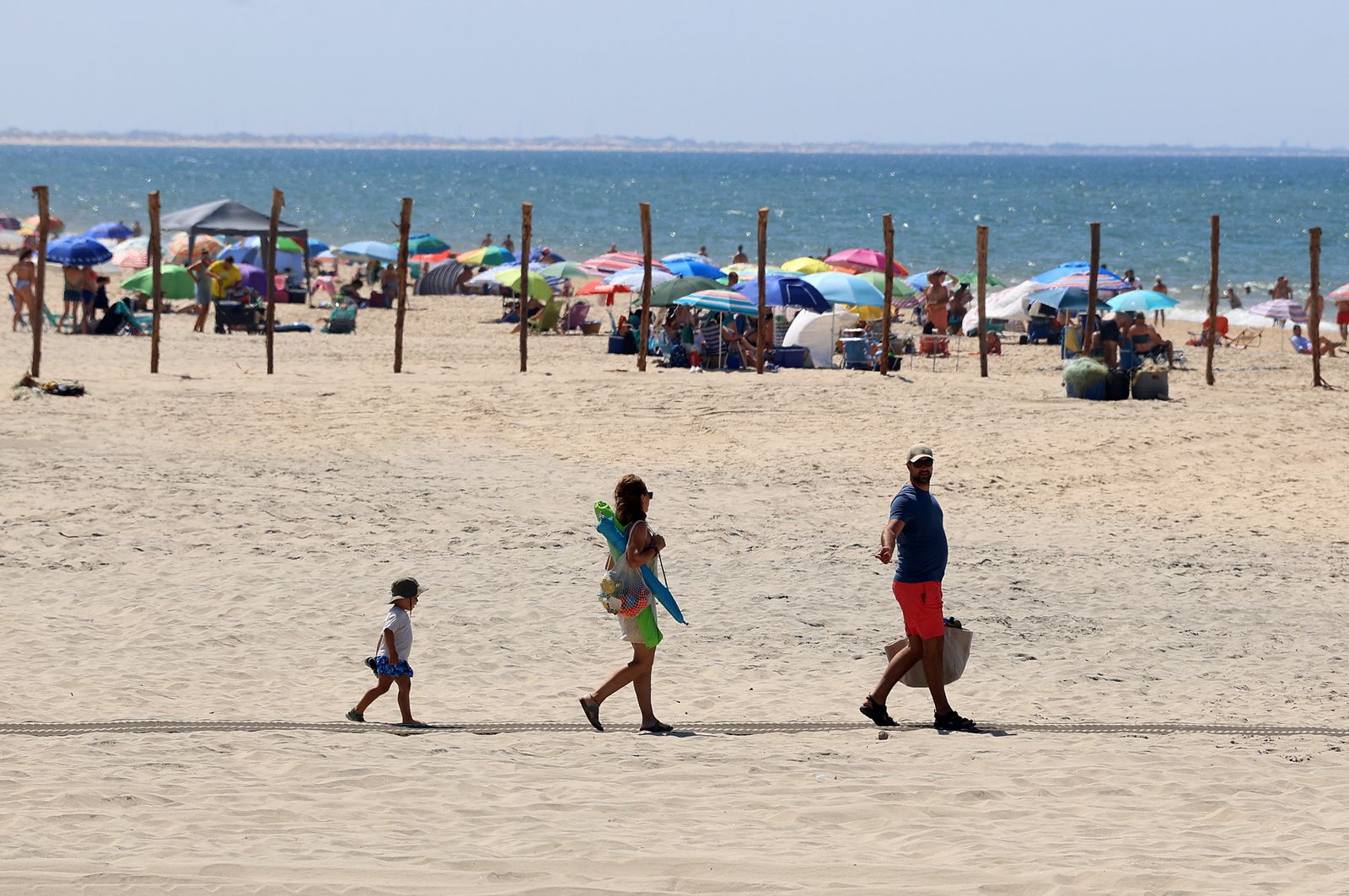 Imágenes de una mañana de calor y playa en Matalascañas