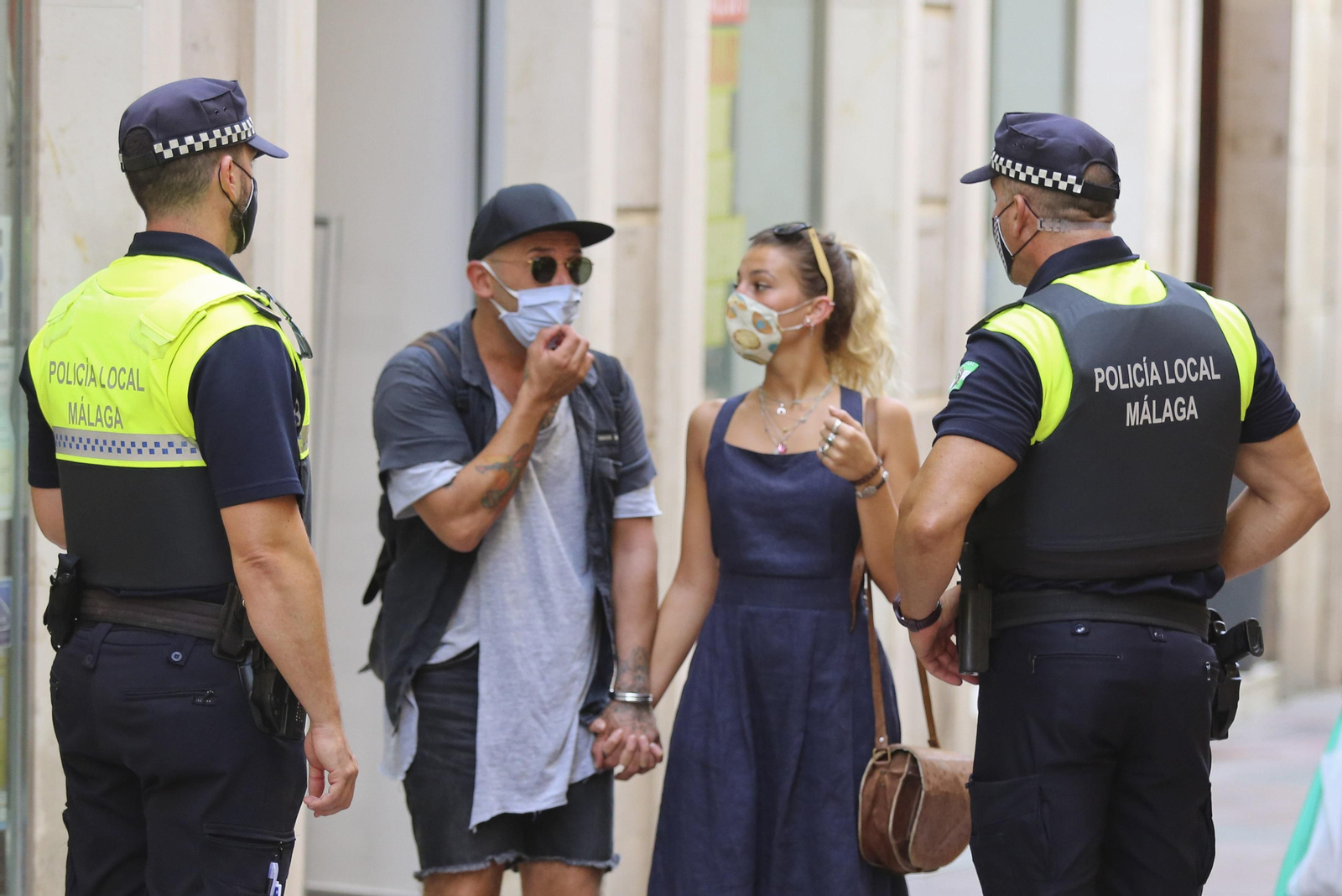Fotos del primer día de mascarillas obligatorias en las playas y el Centro de Málaga