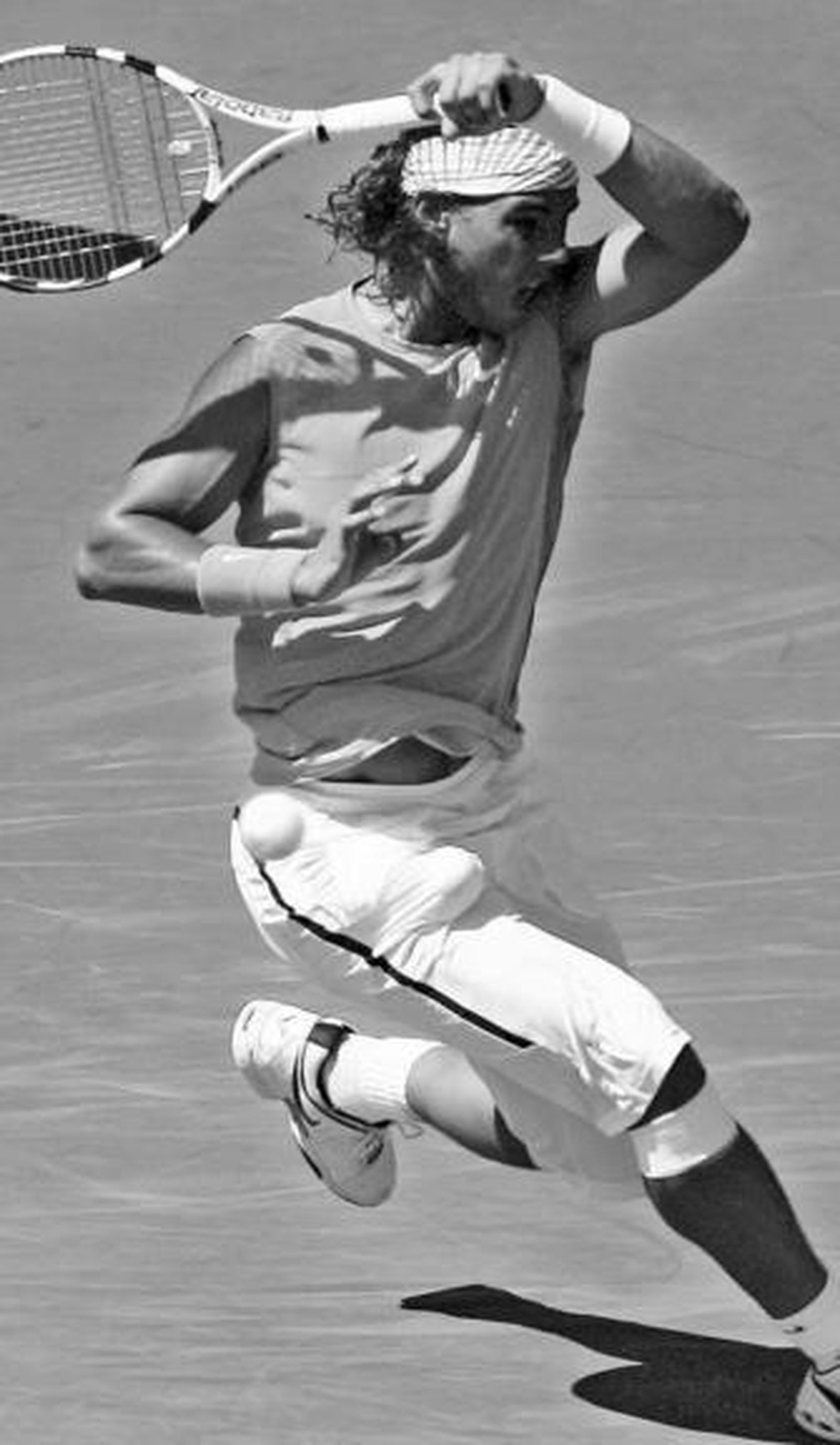 Nadal golpea una bola con efecto en su partido ante Blake.