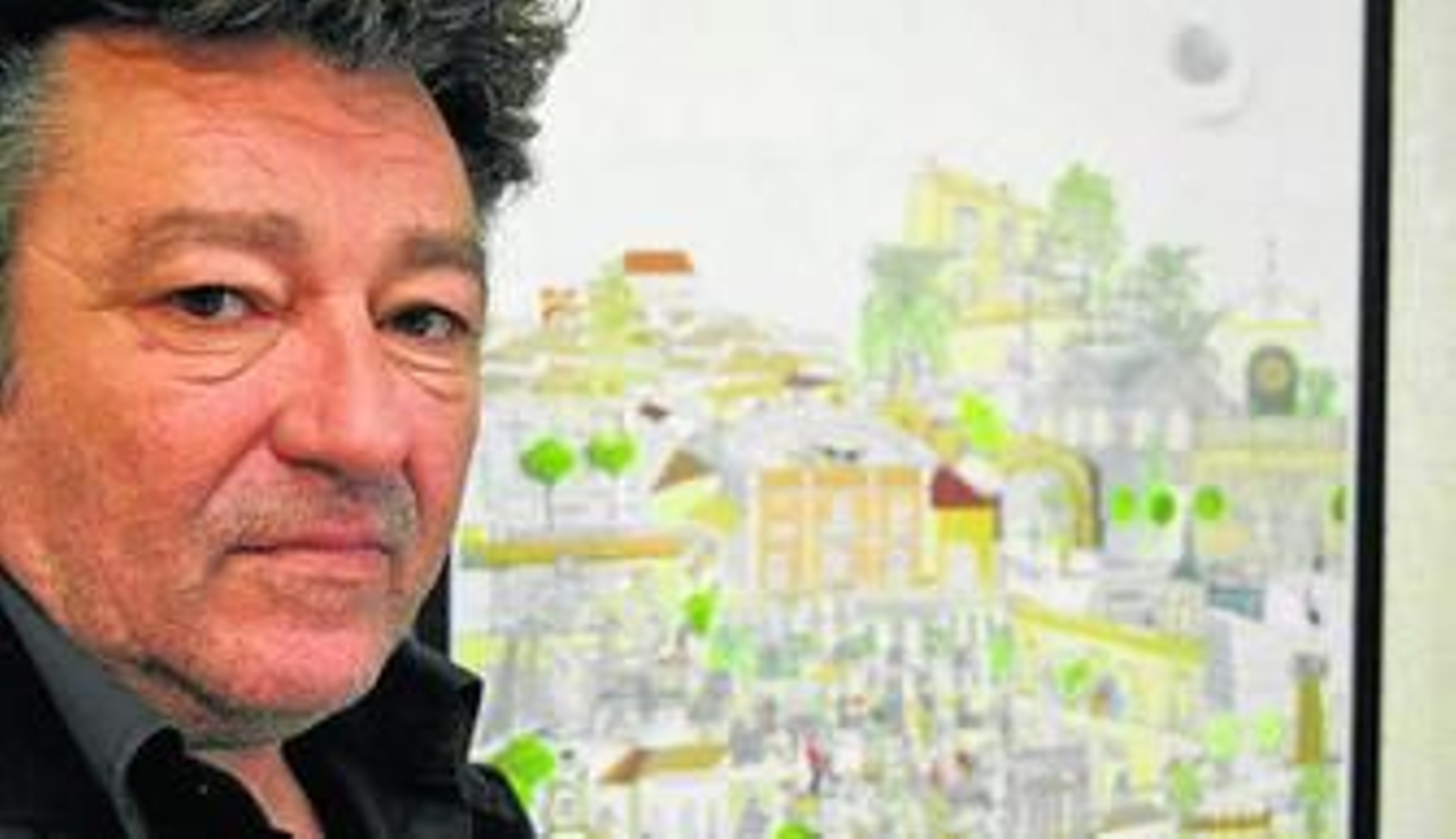 El artista, junto a uno de sus trabajos.