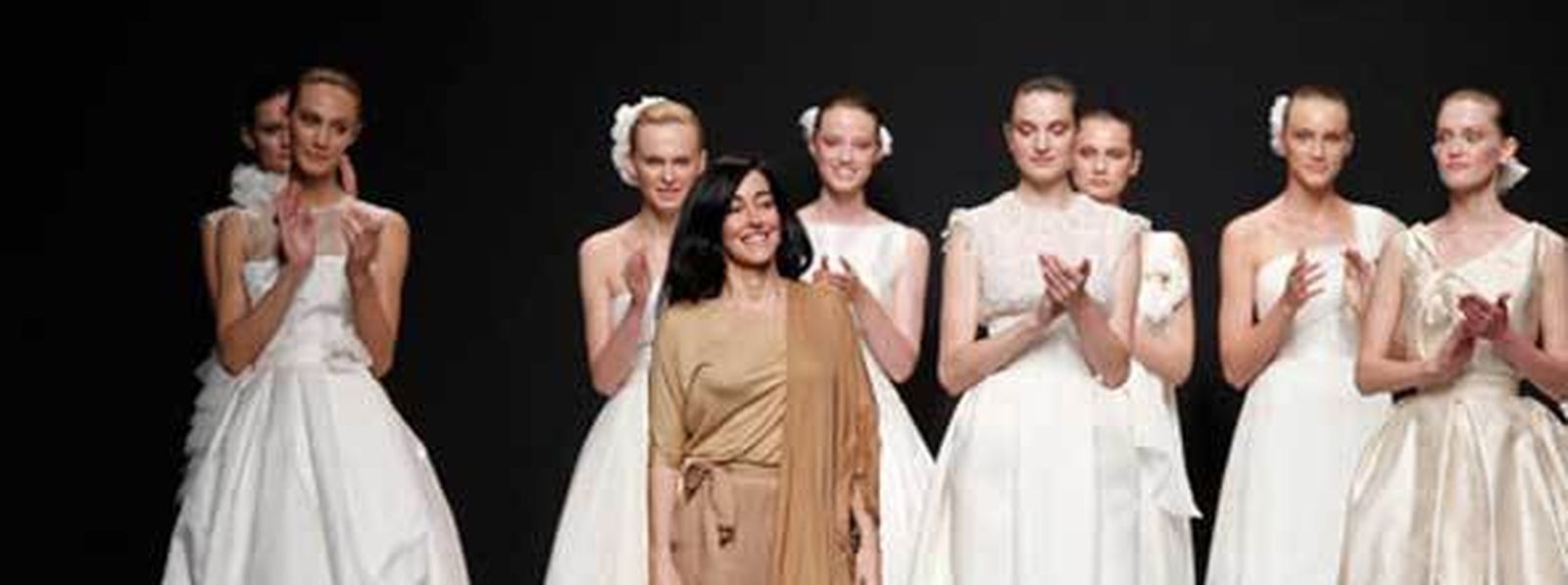 La diseñadora de moda, Paula del Vas, junto con algunos de sus diseños de novias 2012.