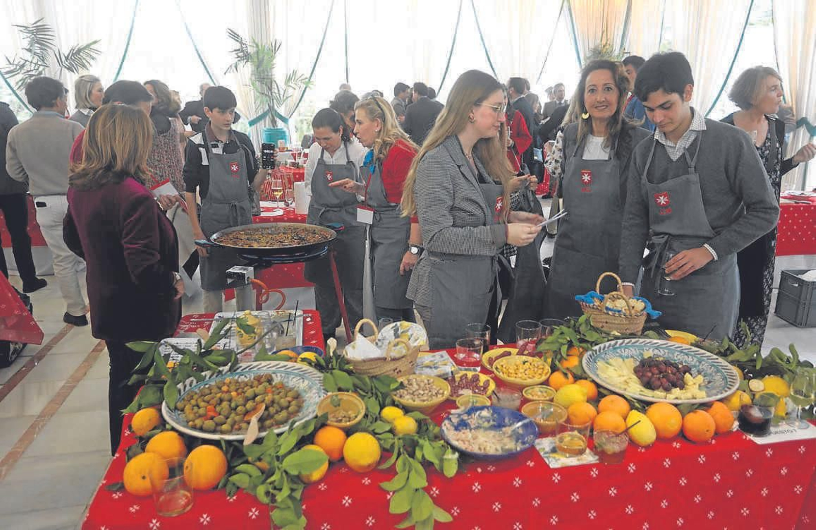 Guisos solidarios a beneficio del comedor de la Orden de Malta en Sevilla