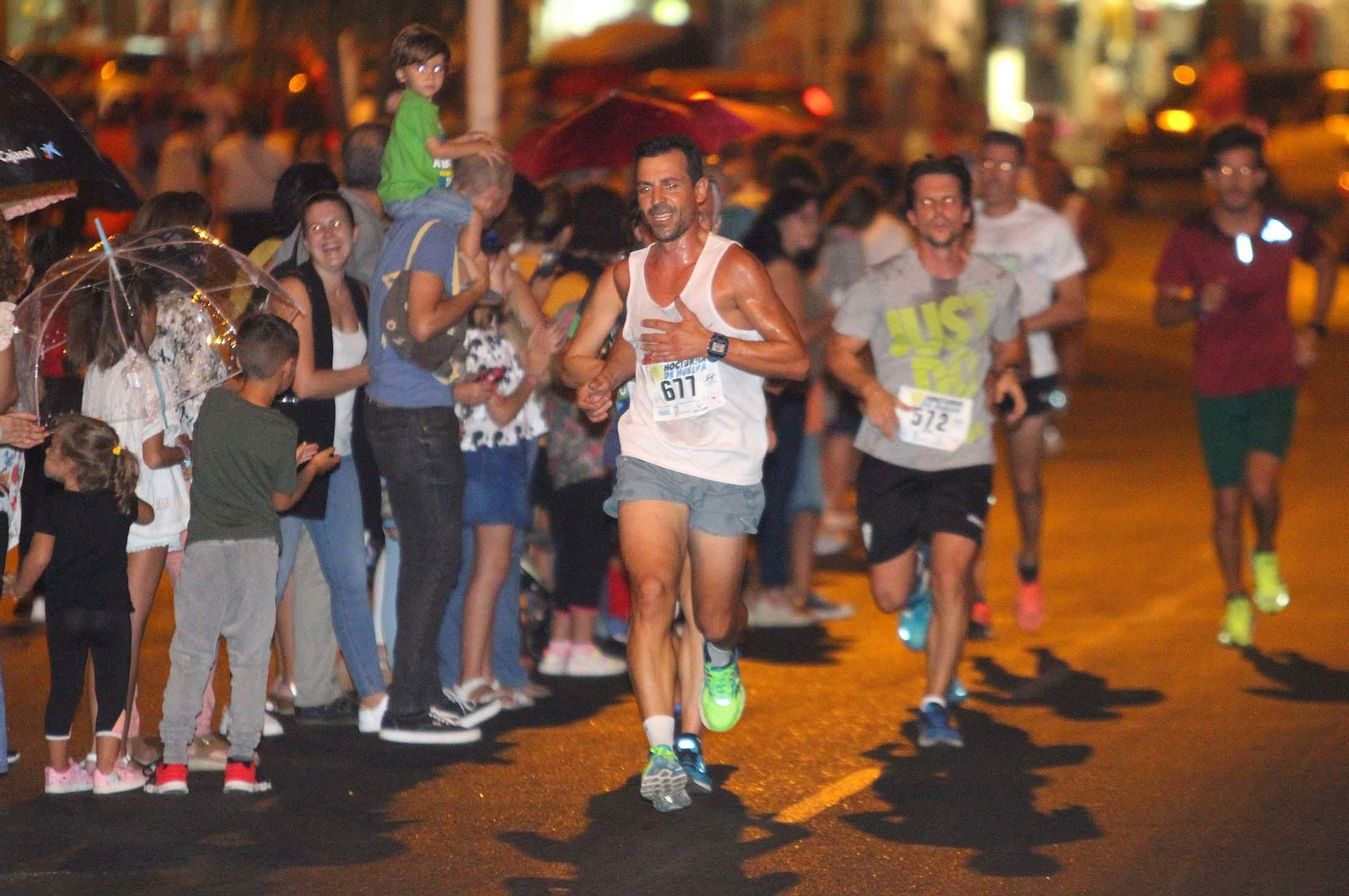 La VII Carrera Nocturna de Huelva en imágenes