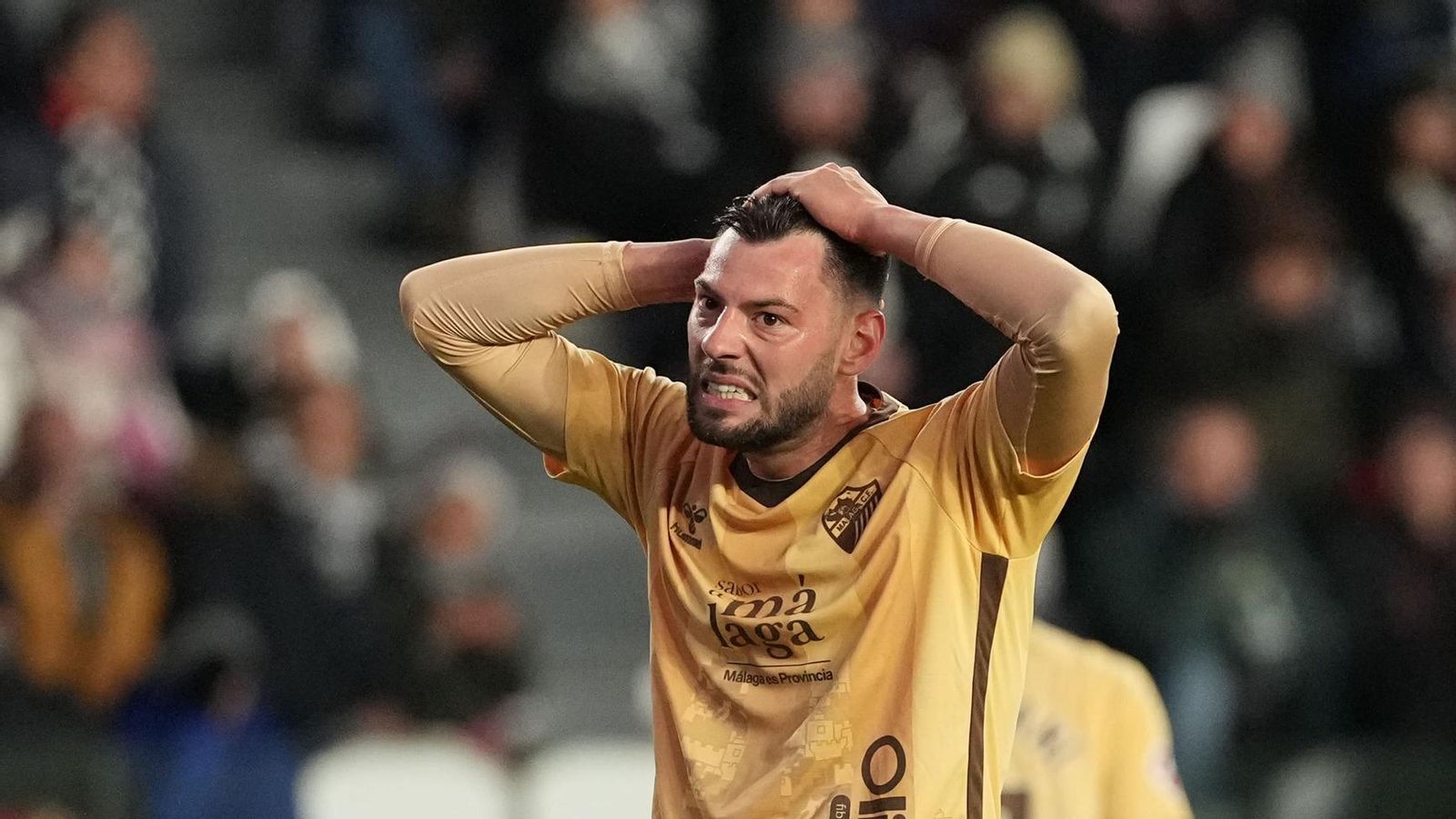 El Burgos-Málaga CF, en fotos