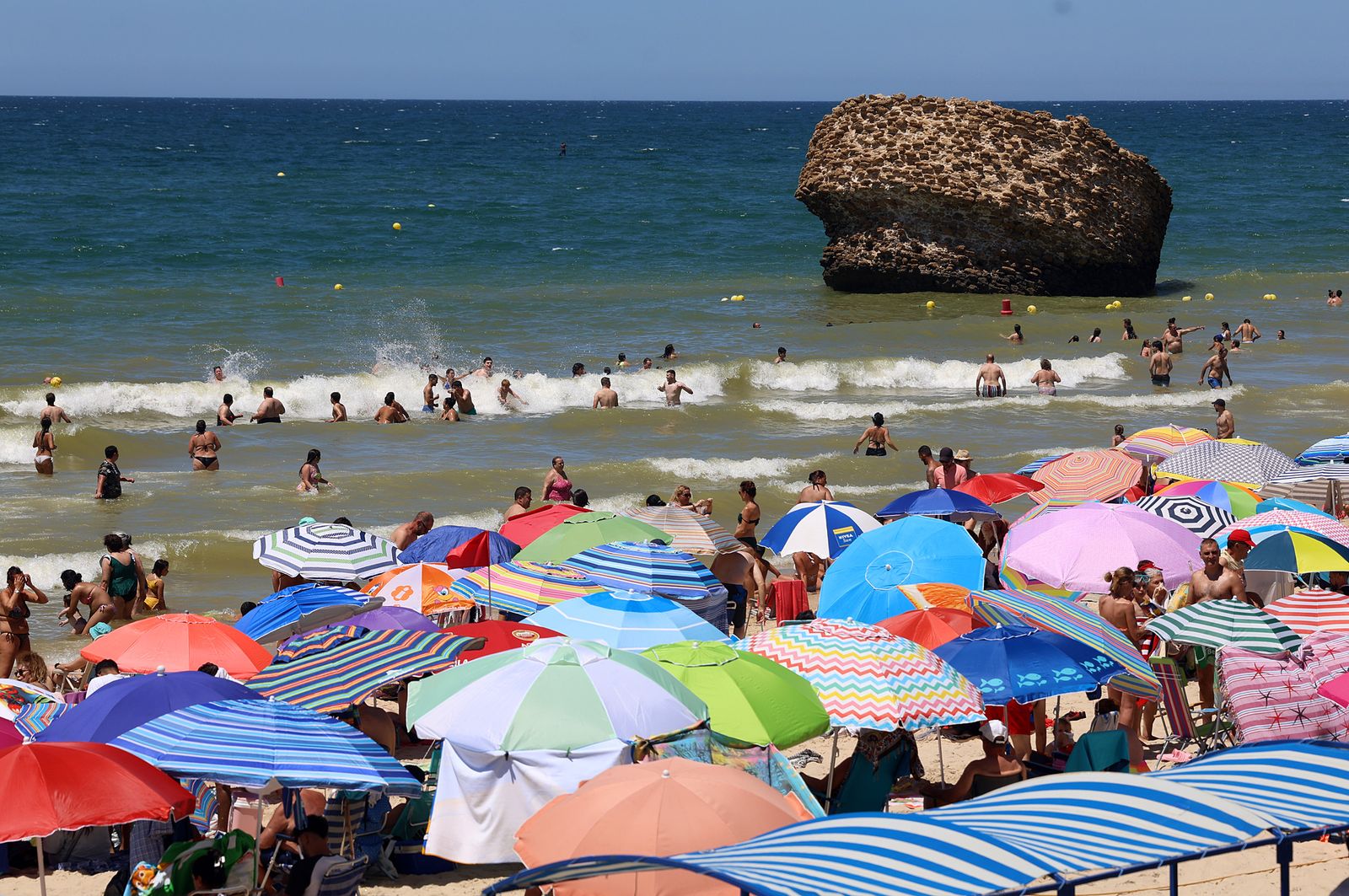 Imágenes de una mañana de calor y playa en Matalascañas
