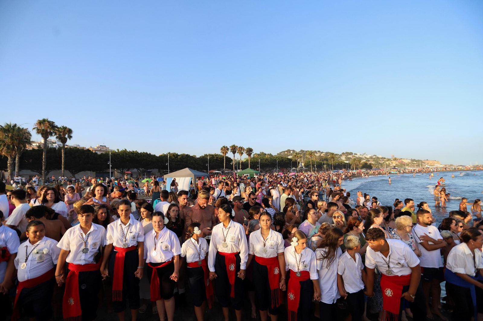 La procesión de la Virgen del Carmen en la playa del Palo, en Málaga, en fotos