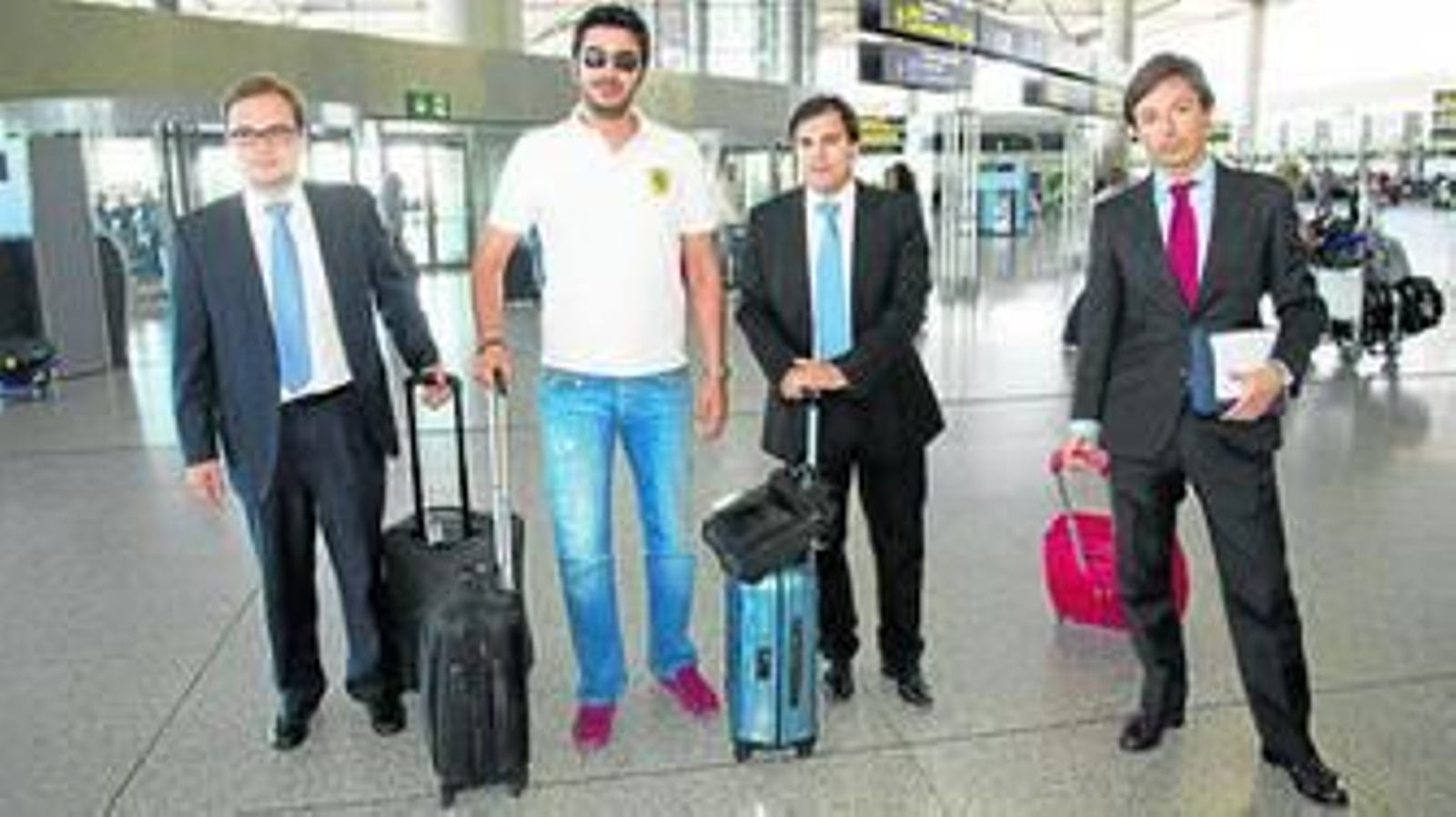Manuel Novo, Moayad Shatat, Vicente Casado y Joaquín Jofre, ayer, instantes antes de partir hacia Lausana.