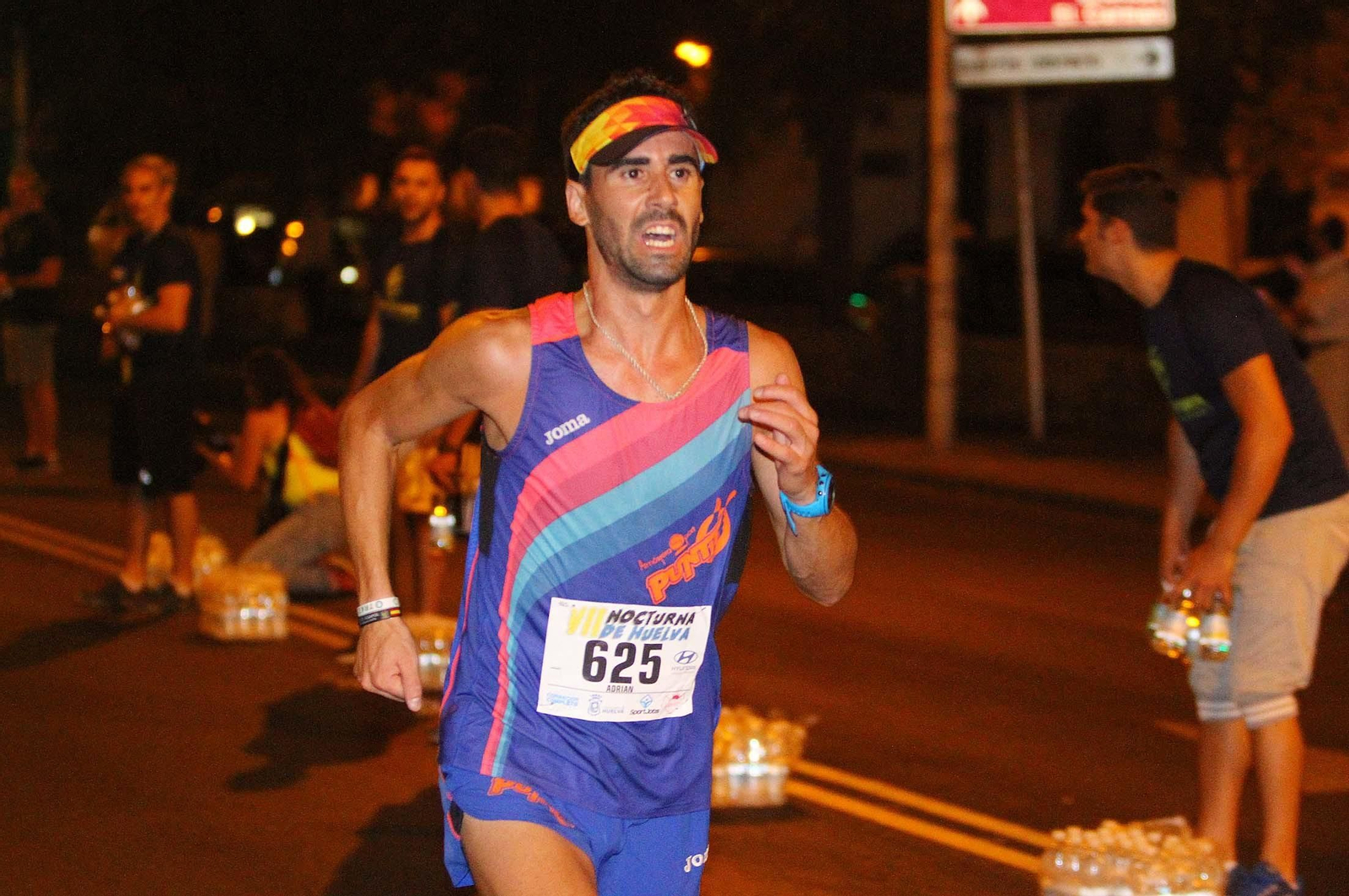La VII Carrera Nocturna de Huelva en imágenes